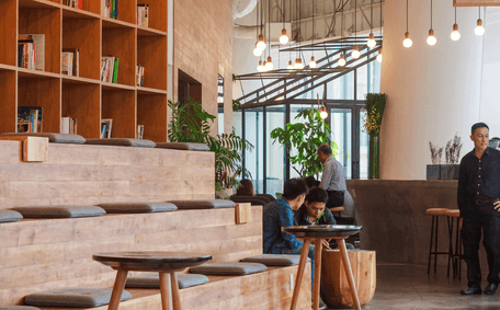 Wooden cafe interior with pendant lights and seating